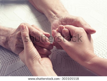 Care is at home of elderly. Space for text. Senior man, with their caregiver at home. Concept of health caring for elderly old people, disabled. Elderly man.