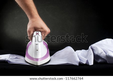 Hand ironing shirt with Hot steam iron