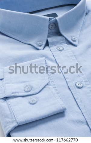 New folded blue men shirt, close-up macro