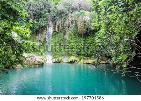 waterfall with falling water on rocks and tree roots Kursunlu Antalya Turkey