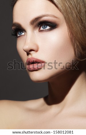 attractive young model with bright make-up and manicure
