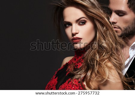 Sexy elegant couple in the tender passion. Beautiful woman near the man.