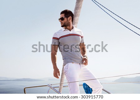 Sailing man on boat in ocean