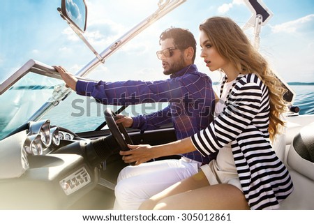 Sexy couple on the luxury yacht
