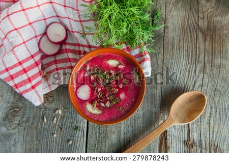 Raw Home made Cold summer Beets soup on the wooden kitchen table