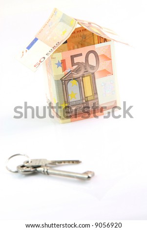 finance banking construction and business concepts house with euro money and keys blur in front isolated on white background