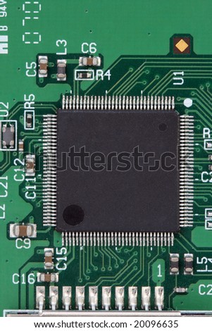black processor on green circuit board detail with copyspace