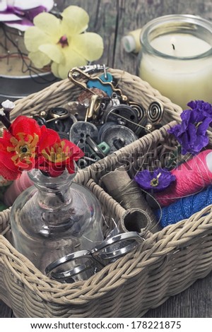 wicker basket with sewing tools and accessories