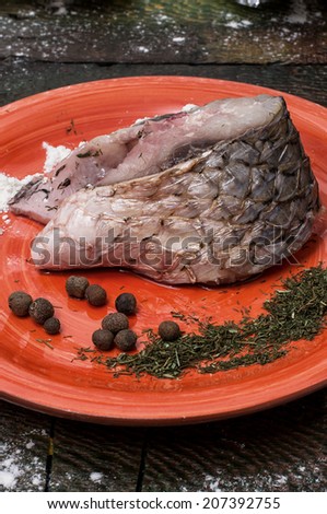cut a slice of raw fish in lemon and spices