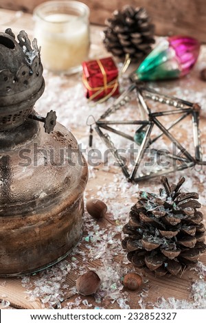 old-fashioned kerosene lamp,Christmas toys,pine cones