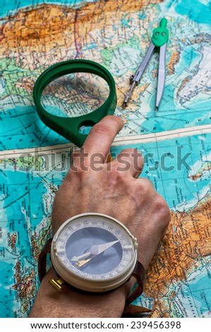 hand to indicate the route on topographic map