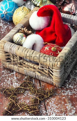 Christmas ornaments in wooden wicker box.Photo tinted.