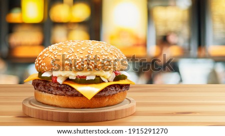 Delicious Cheese Beef Burger consists of Bun Bread, Patty, Pickle, Onion, Mayonaisse, Ketchup and Cheddar Cheese in a yellow background, with interactive 3D text for Modern Fast Food Restaurant