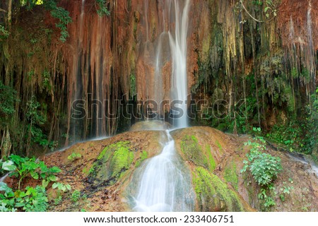 Waterfall in Thailand. Phu Sang waterfall is 35 degree Celsius water temperatures that flows from a limestone cliff 25 meters high.