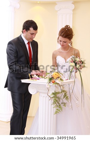 Romantic image of attractive couple at  wedding official ceremony