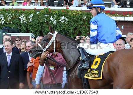 SARATOGA SPRINGS, NY - AUGUST 18: Questing (GB) with Irad Ortiz Jr. aboard in the winners circle for the Grade I Alabama Stakes on August 18, 2012 in Saratoga Springs, NY