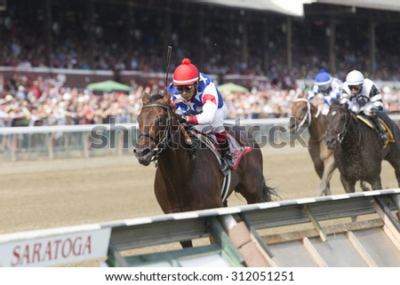 SARATOGA SPRINGS, NY - August 29, 2015: Runhappy ridden by Edgar Prado wins the King\'s Bishop Stakes on Travers Day at Historic Saratoga Race Course on August 29, 2015 Saratoga Springs, New York