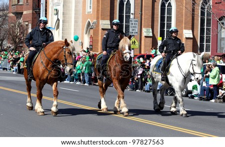 ALBANY, NY - MARCH 17: Albany New York Police department mounted unit in the 2012 St. Patrick\'s Day Parade on March 17, 2012 in Albany, New York.