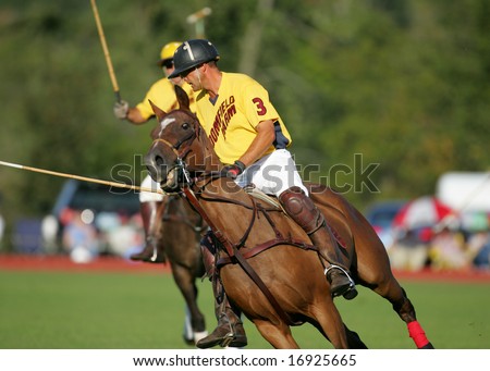 SARATOGA SPRINGS - August 27: Unidentified Polo Players and Horse galloping in fast Action during match at Saratoga Polo Club August 27, 2008 in Saratoga Springs, NY.
