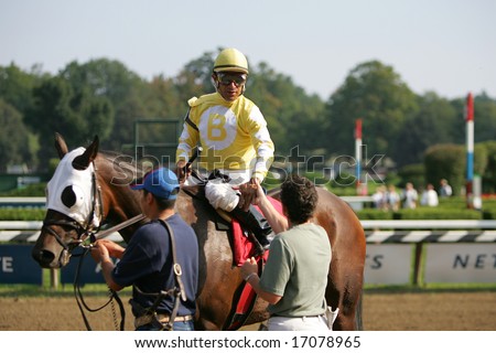 SARATOGA SPRINGS - August 24: Cornellio Velasquez Aboard Lady Rizzi Outside the Winners Circle After the Seventh race August 24, 2008 in Saratoga Springs, NY.