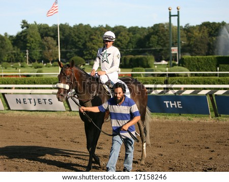 SARATOGA SPRINGS - August 23: Garrett K. Gomez Aboard Colonel John outside the Winners Circle after winning hthe 139th Running of the Travers Stakes August 23, 2008 in Saratoga Springs, NY.