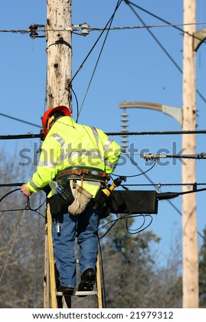 Albany - December 13: Lineman for the Utility Companies Make Repairs to Downed Power and Telephone Lines in After An Ice Storm on December 13, 2008 in Albany, NY