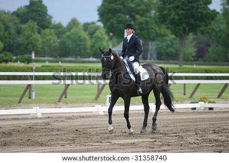 SARATOGA SPRINGS - MAY 23: Christina Hamilton competes on Evening Star the Open Division at the Dressage May 23, 2009 in Saratoga Springs, NY.