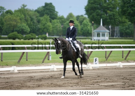 SARATOGA SPRINGS - MAY 23: Christina Hamilton competes on Evening Star in the Open Division at the Dressage May 23, 2009 in Saratoga Springs, NY.