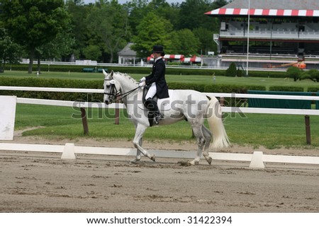 SARATOGA SPRINGS - MAY 23: Mary Bahniuk Lauritsen competes on ToyBoy in Junior Division at the Dressage May 23, 2009 in Saratoga Springs, NY.