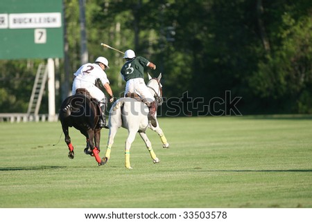 SARATOGA SPRINGS - JULY 10: M. Sosa number 2 of Buckleigh battle for the ball during the opening match of the season at Saratoga Polo Club July 10, 2009 in Saratoga Springs, NY.