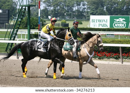 ELMONT, NY- JULY 25: Michael Luzzi abord Living out a Dream in the post parade for the forth race at Belmont Park- July 25, 2009 in Elmont, NY.