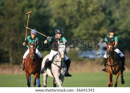 SPRINGS - SEPTEMBER 4 : John Walsh (C) of Americas Most Wanted leads the play up field at Saratoga Polo Club September 4, 2009 in Saratoga Springs, NY.