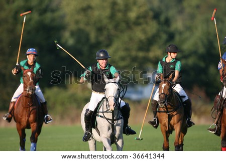 SPRINGS - SEPTEMBER 4 : John Walsh (2nd from L) of Americas Most Wanted leads the play up field at Saratoga Polo Club September 4, 2009 in Saratoga Springs, NY.