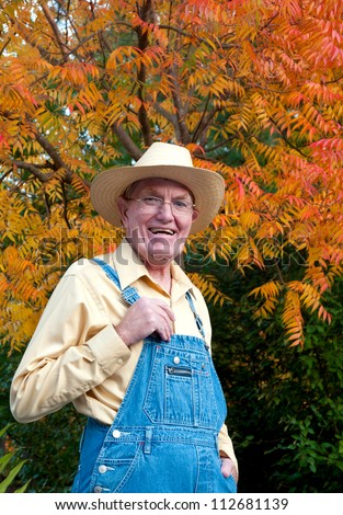 A farmer with a happy look on his face.