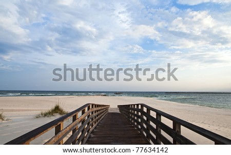 Scene of a walkway leading to the beach at Perdido Pass on the Alabama Gulf Coast.