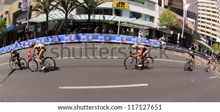 AUCKLAND-OCT. 20: Women participants in the ITU World Triathlon Grand Final Series cycle the main street of downtown Auckland. on Saturday, Oct. 20, 2012.