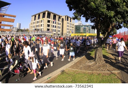 AUCKLAND - MARCH 13: Participants of Auckland Round the Bays, one of the world\'s largest fun walk and run with an estimated 70,000 entrants, in Auckland, New Zealand on Sunday March 13, 2011.