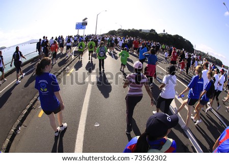 AUCKLAND - MARCH 13: Participants of Auckland Round the Bays, one of the world's largest fun walk and run with an estimated 70,000 entrants, in Auckland, New Zealand on Sunday March 13, 2011.