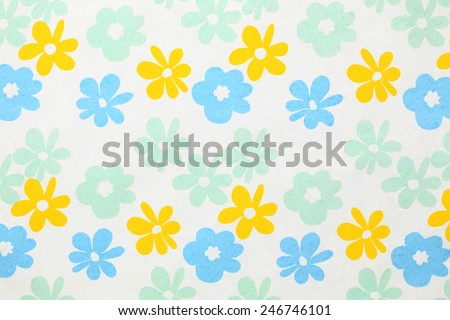 White paper with red, blue and green flowers for background