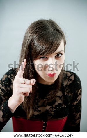 Gothic girl pointing with finger