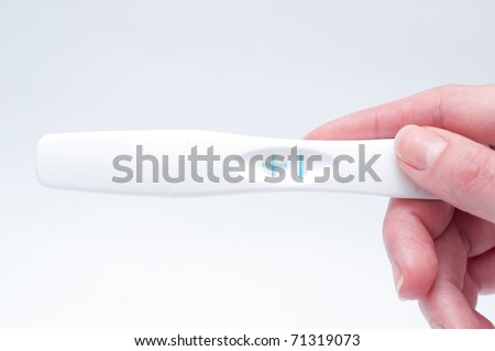 Holding positive pregnancy test
