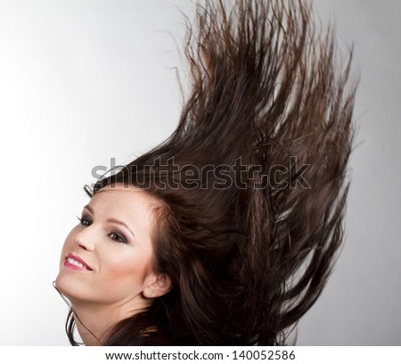 young girl with blowing hair