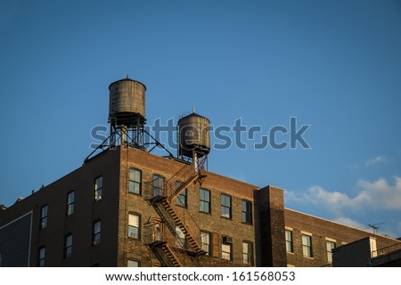 Old factory with water towers on roof, New York City