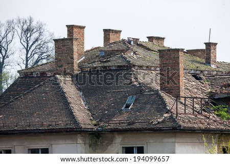 Old tile rooftops and brick chimneys in Sisak, Croatia.