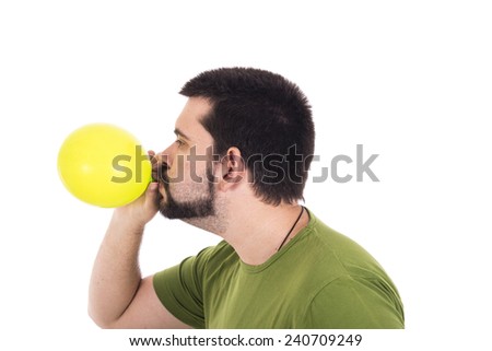 Crazy guy blowing green balloon