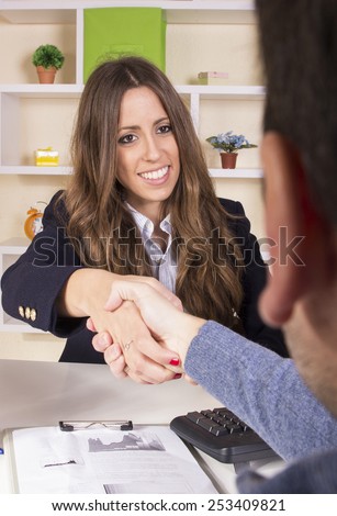 Business girl working in front of desktop at office