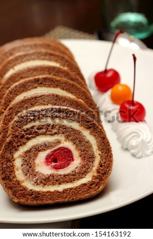 A Chocolate cherry  roll with stuffing  close-up