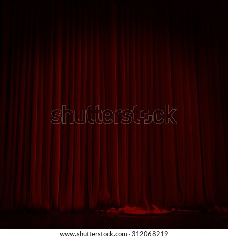 Red curtain with spot light on theater or cinema stage.