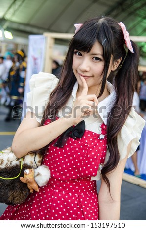 BANGKOK - SEPTEMBER 01 : An unidentified Japanese anime cosplay pose in Japan Festa in Bangkok 2013 on September 01, 2013 at Central World, Bangkok, Thailand