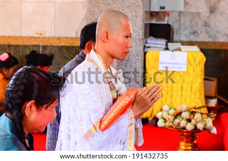 BANGKOK,THAILAND - APRIL 27 : Newly ordained Buddhist monk pray with priest procession. Newly ordained Buddhist monks have a ritual in the temple procession on April 27,2014 in Bangkok,Thailand